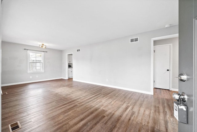 empty room featuring hardwood / wood-style floors