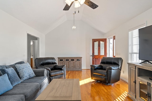 living room featuring light hardwood / wood-style floors, ceiling fan, and lofted ceiling