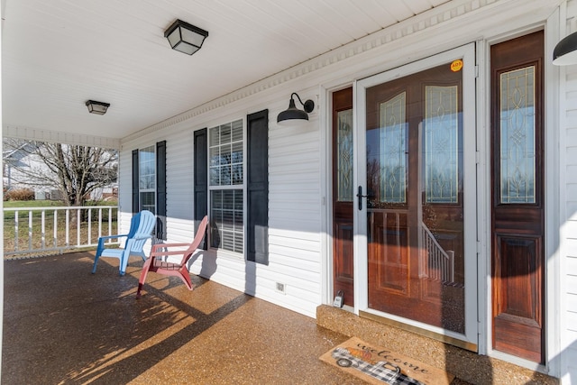 property entrance with covered porch