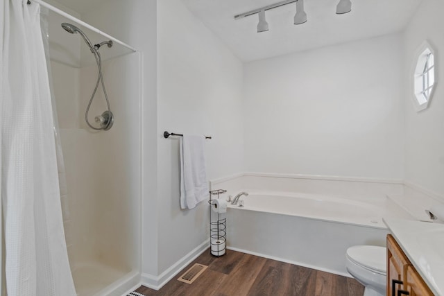 full bathroom with vanity, separate shower and tub, toilet, and wood-type flooring