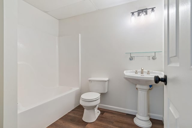 bathroom with wood-type flooring and toilet