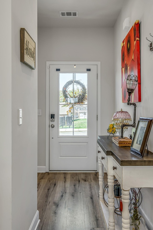 entryway with hardwood / wood-style flooring