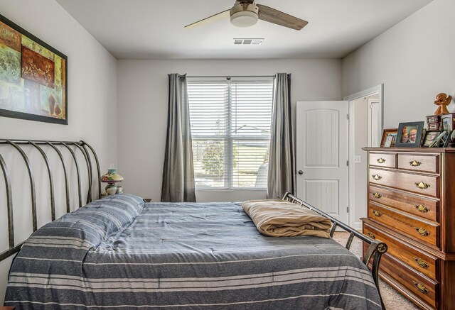 bedroom featuring ceiling fan and carpet floors