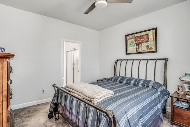 carpeted bedroom featuring ceiling fan and ensuite bath