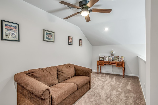 living room featuring light colored carpet, vaulted ceiling, and ceiling fan