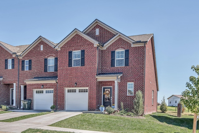 view of front facade with a garage and a front lawn