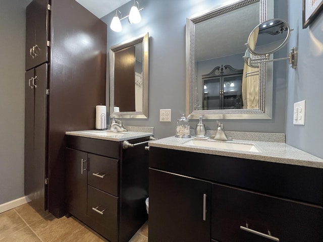 bathroom with tile patterned flooring and vanity