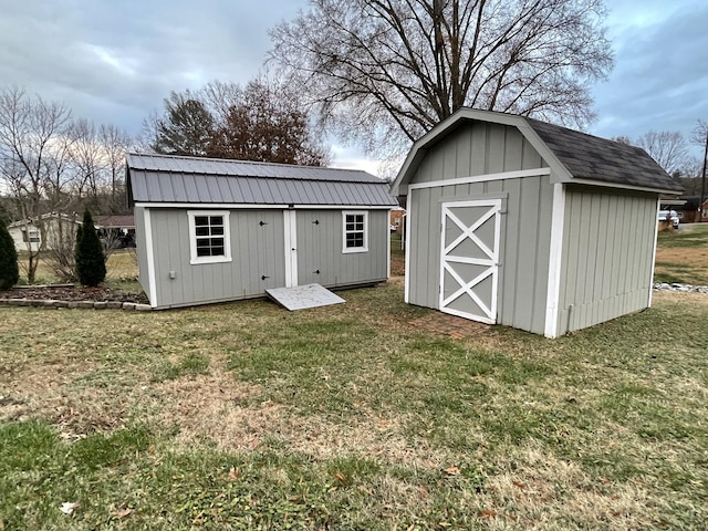 view of outbuilding with a yard