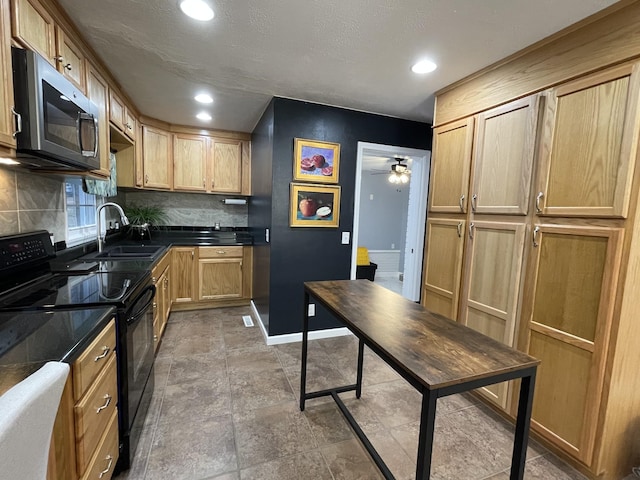 kitchen with light brown cabinets, black range with electric stovetop, sink, ceiling fan, and tasteful backsplash