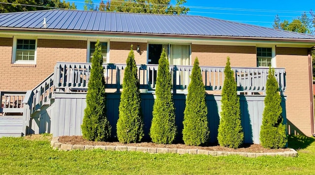 view of side of home with covered porch