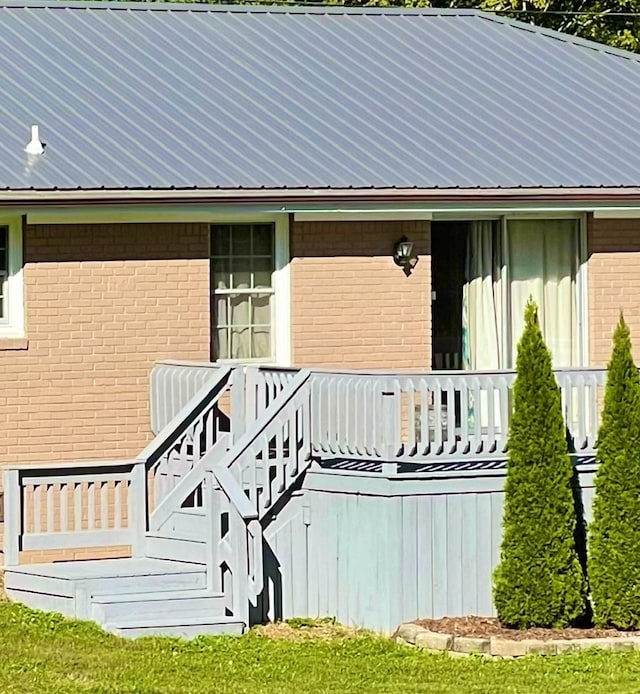 property entrance with a deck