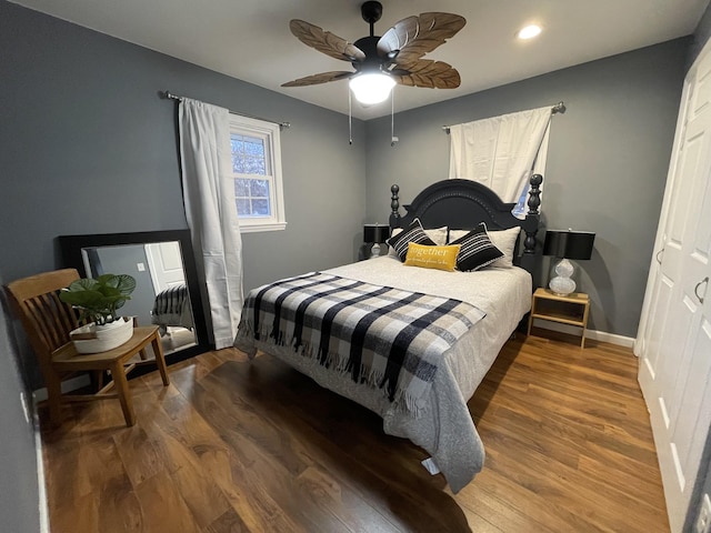 bedroom featuring hardwood / wood-style floors and ceiling fan