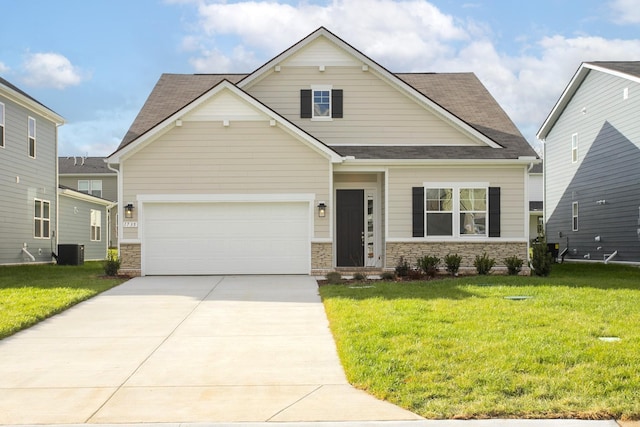 craftsman house featuring a front yard, a garage, and central air condition unit