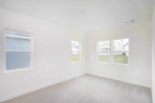 empty room with light colored carpet