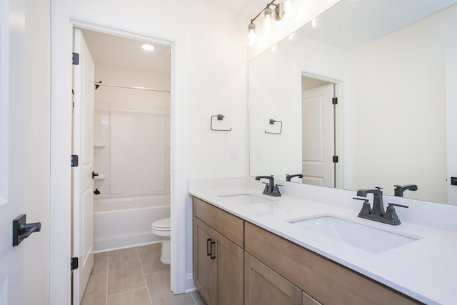 full bathroom with tile patterned flooring, vanity, shower / bathtub combination, and toilet