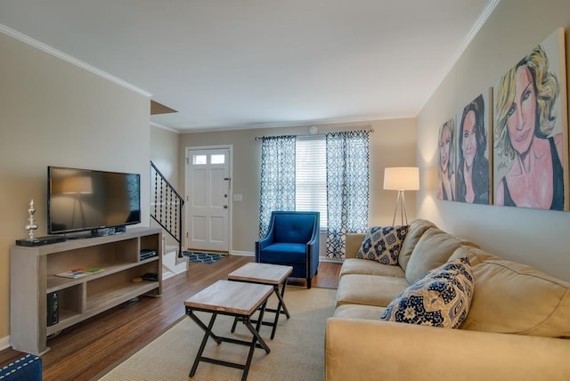 living room with hardwood / wood-style flooring and ornamental molding