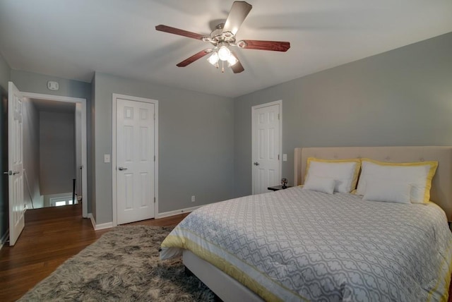 bedroom featuring ceiling fan and dark wood-type flooring