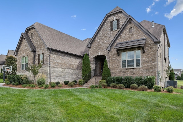 french country style house with a front yard