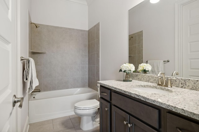 full bathroom with vanity, tile patterned floors, tiled shower / bath combo, toilet, and ornamental molding