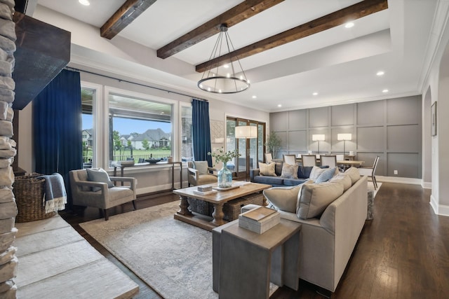 living room featuring hardwood / wood-style flooring, ornamental molding, beamed ceiling, and an inviting chandelier