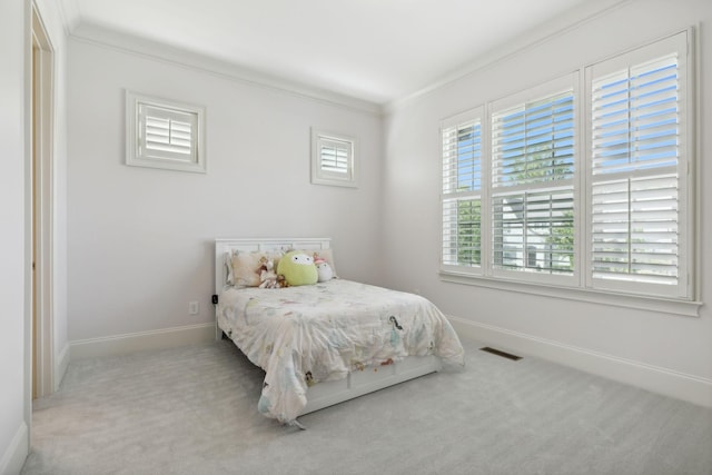 bedroom featuring carpet floors and ornamental molding