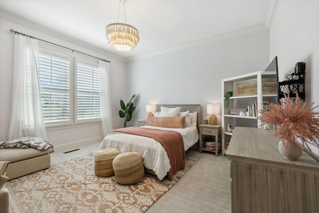 carpeted bedroom featuring crown molding and a chandelier