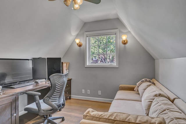 office area with ceiling fan, light hardwood / wood-style flooring, and vaulted ceiling