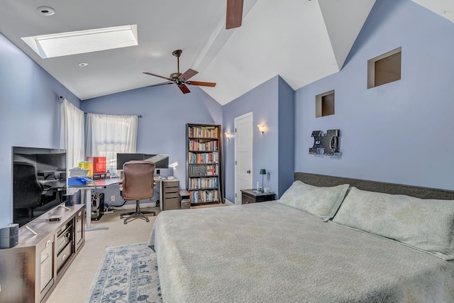 carpeted bedroom featuring ceiling fan and vaulted ceiling with skylight