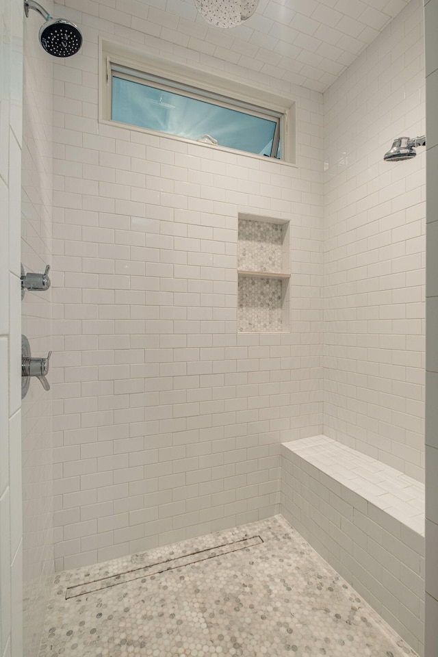 bathroom featuring tiled shower