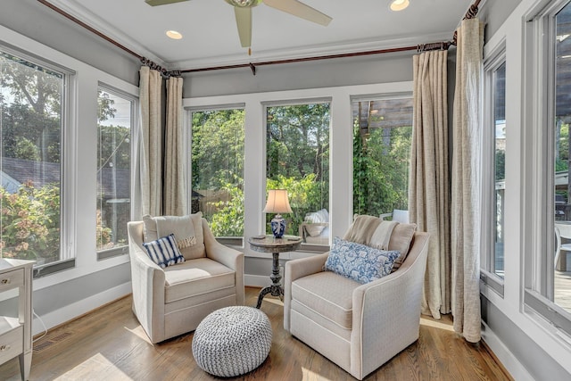 sunroom featuring a wealth of natural light and ceiling fan