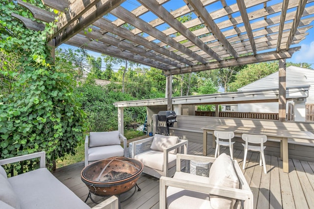 deck with a fire pit and a pergola