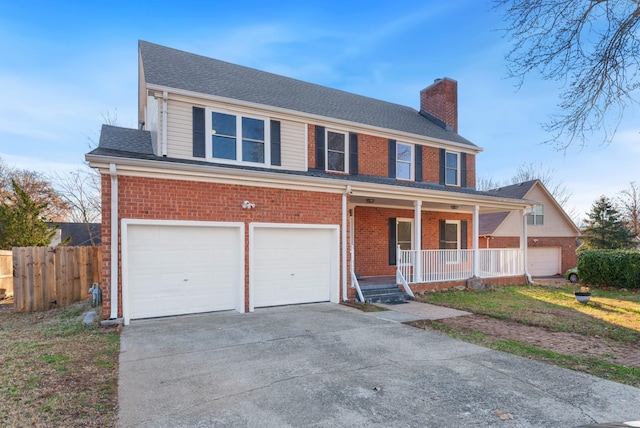 view of front facade featuring covered porch and a garage