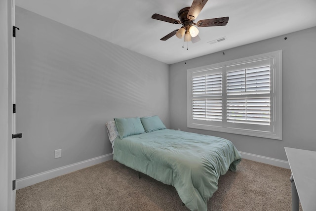 bedroom featuring light carpet and ceiling fan