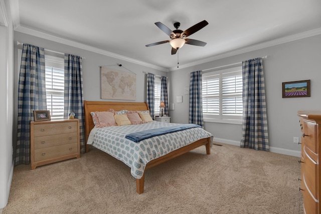 bedroom featuring light colored carpet, ceiling fan, and crown molding