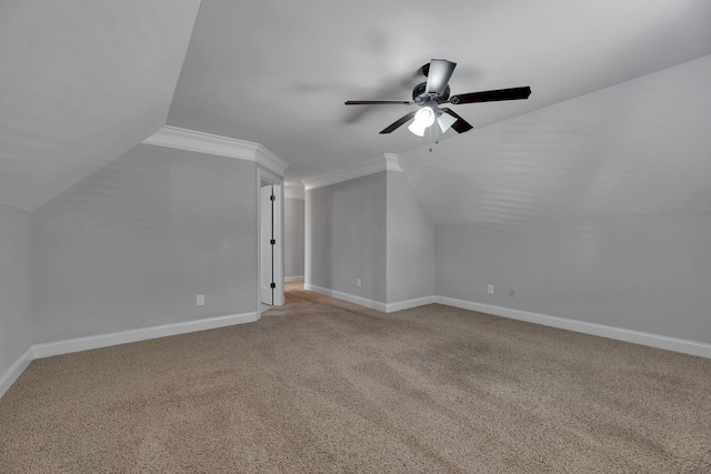 additional living space with ceiling fan, carpet floors, and vaulted ceiling