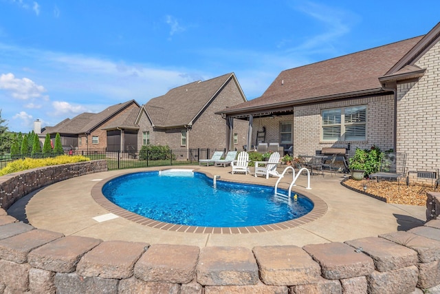 view of pool featuring a patio