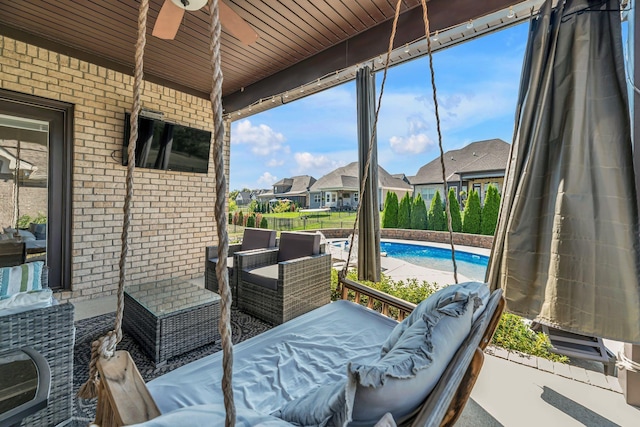 sunroom / solarium with ceiling fan