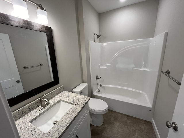 full bathroom featuring washtub / shower combination, vanity, and toilet