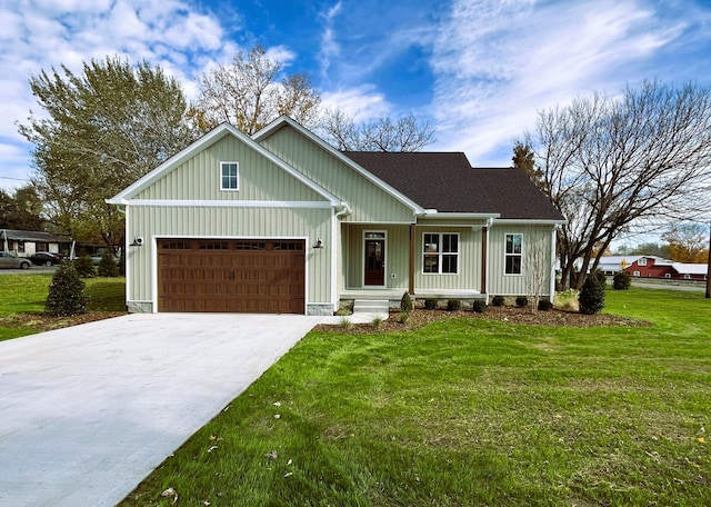 view of front of property featuring a garage and a front lawn