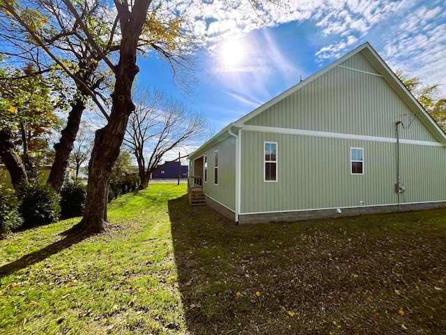 view of property exterior featuring a yard