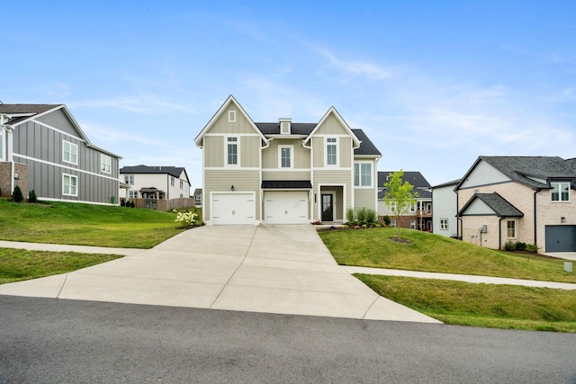 view of front of property featuring a garage and a front lawn