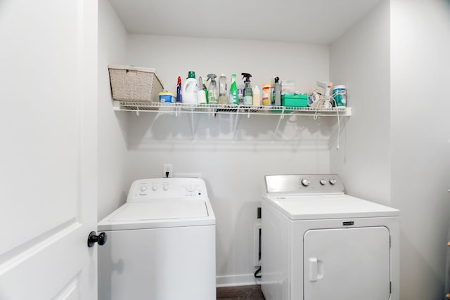 laundry room featuring washing machine and clothes dryer