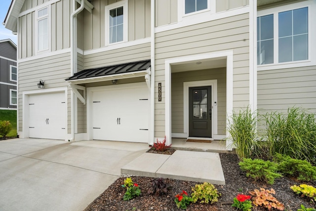 doorway to property with a garage