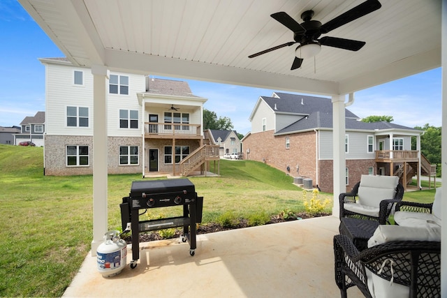 view of patio with a grill and ceiling fan