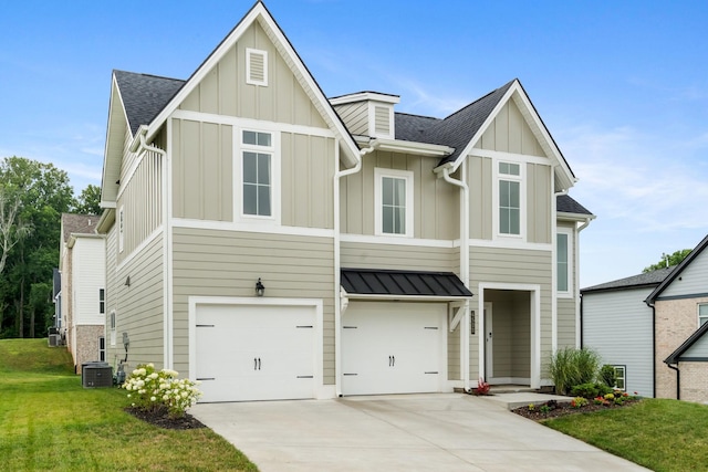 view of front of property with a front lawn, cooling unit, and a garage