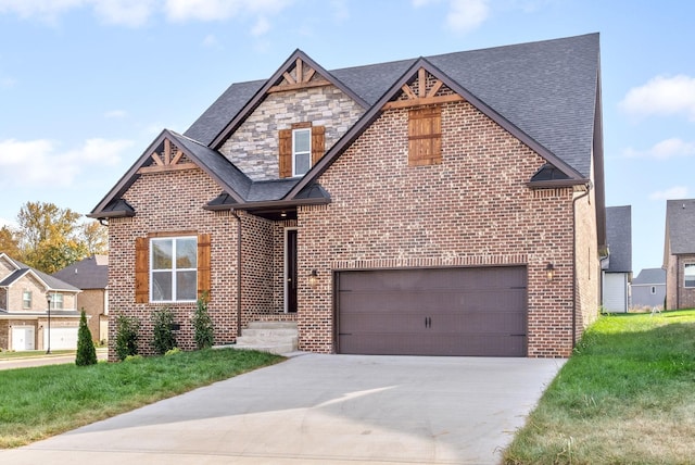 view of front facade with a garage and a front lawn