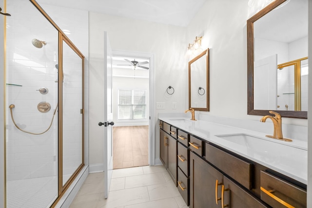 bathroom featuring ceiling fan, tile patterned flooring, vanity, and a shower with shower door