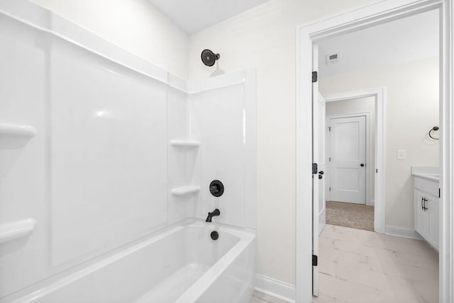 bathroom featuring vanity and bathing tub / shower combination