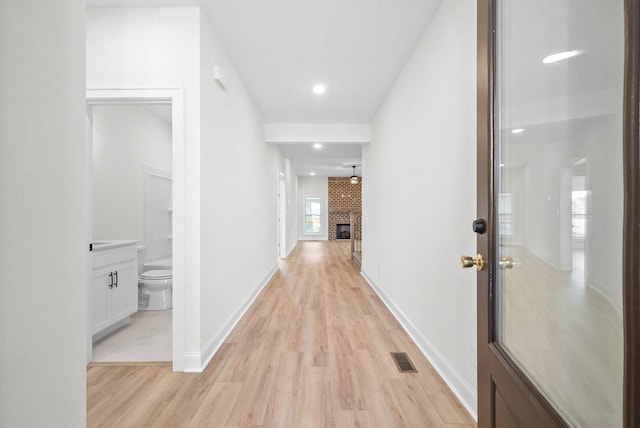 hall with light wood-type flooring