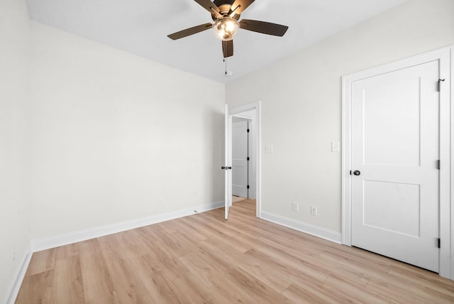 unfurnished bedroom featuring ceiling fan and light wood-type flooring